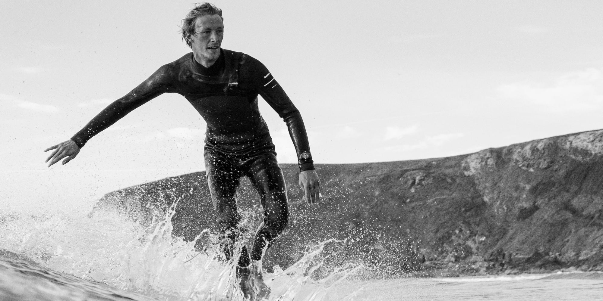 Black and White Image of a Surfer In Cornwall