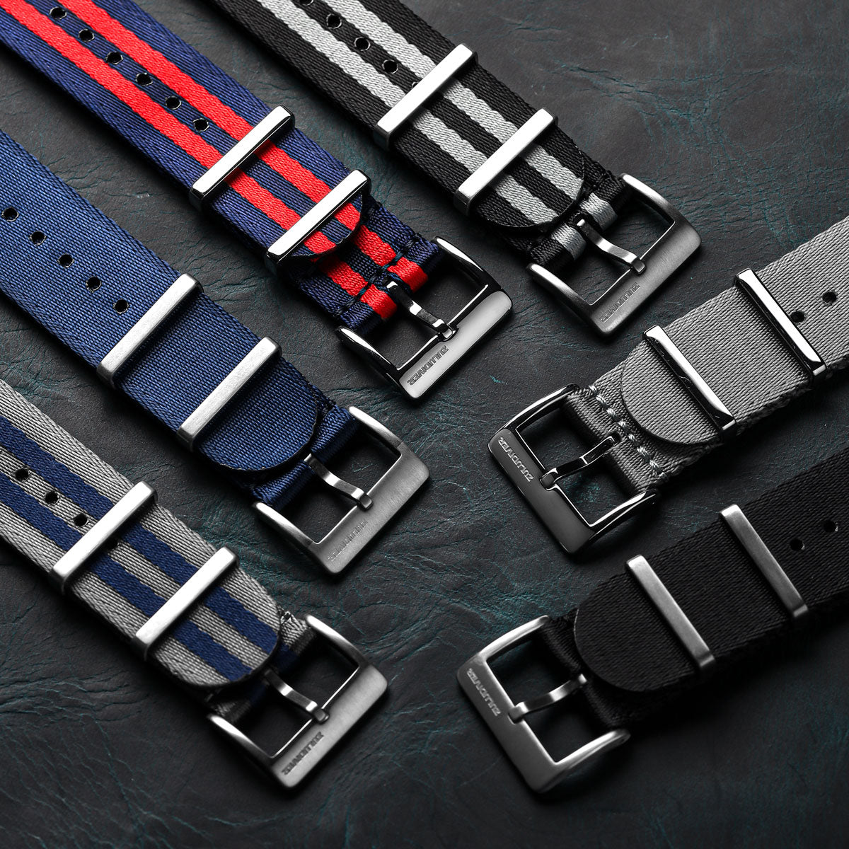 Premium NATO watch straps, blue and red striped seat belt nylon material, with satin hardware, white background image