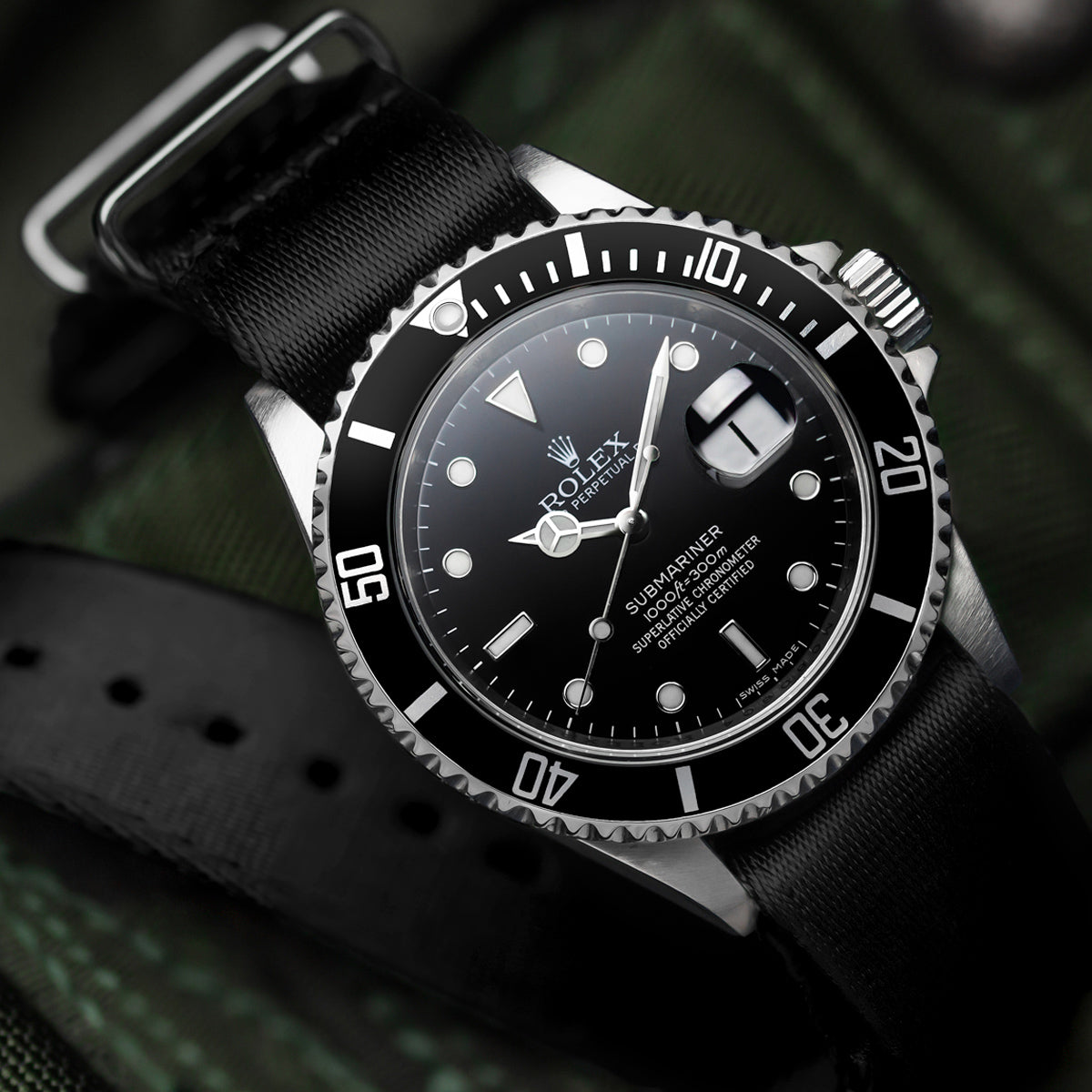 Black seat belt NATO Watch Straps, fitted to a Rolex Perpetual Submariner mechanical watch
