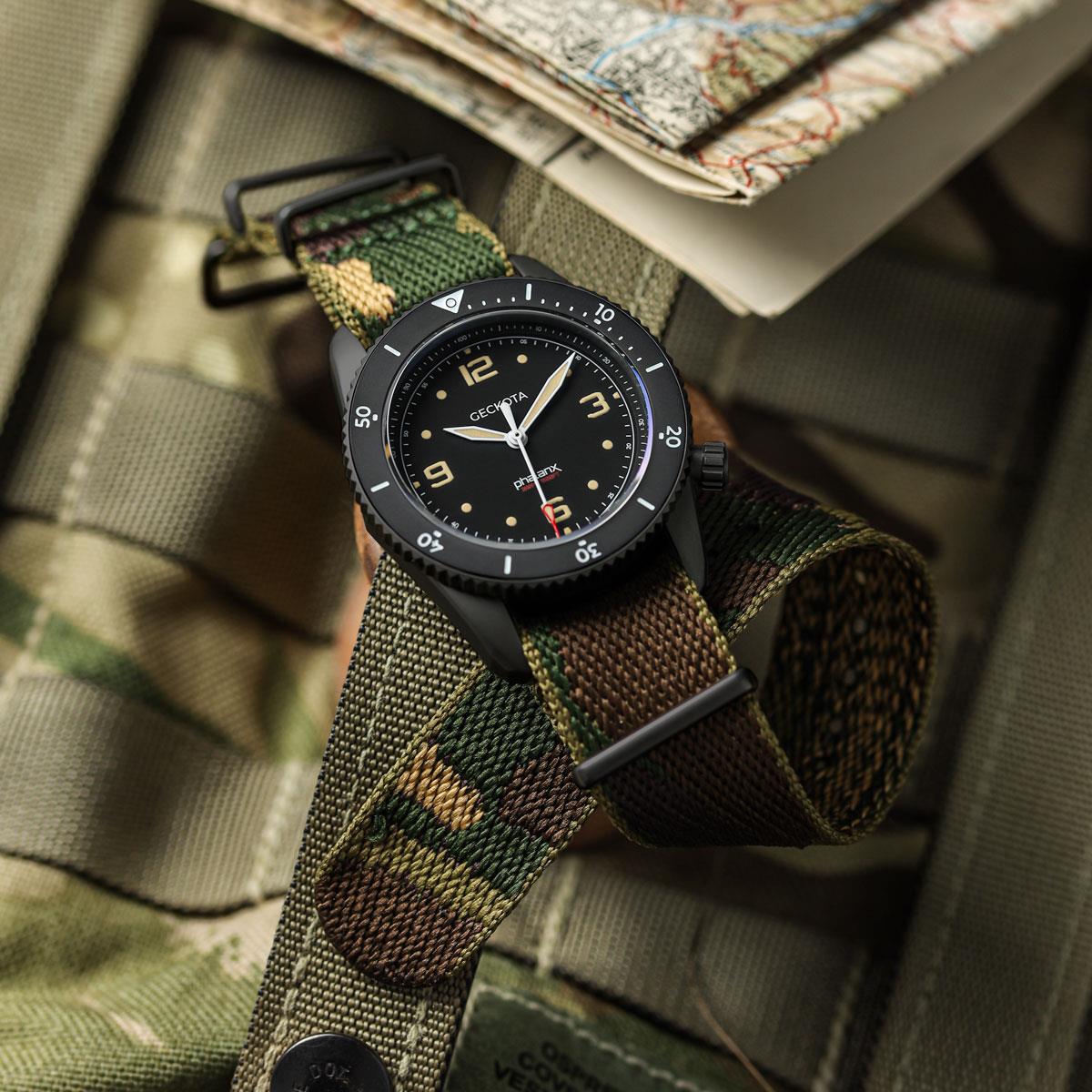 Woven camouflage NATO watch strap with PVD black metal fittings