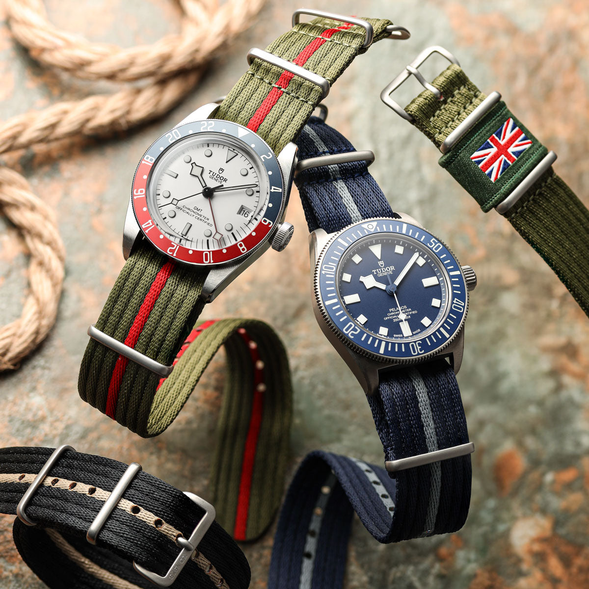 Tudor GMT watch and Tudor Pelegos fitted to 1973 British Military style nylon watch straps, floating above a textured background