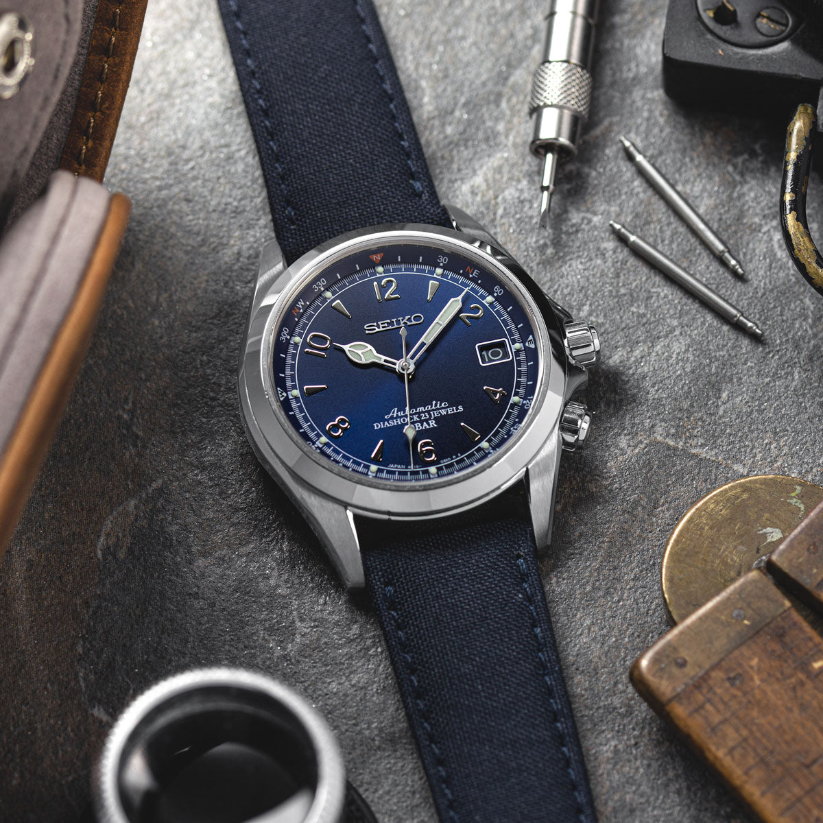 Seiko automatic watch fitted with a navy blue SEAQUAL sailcloth watch strap